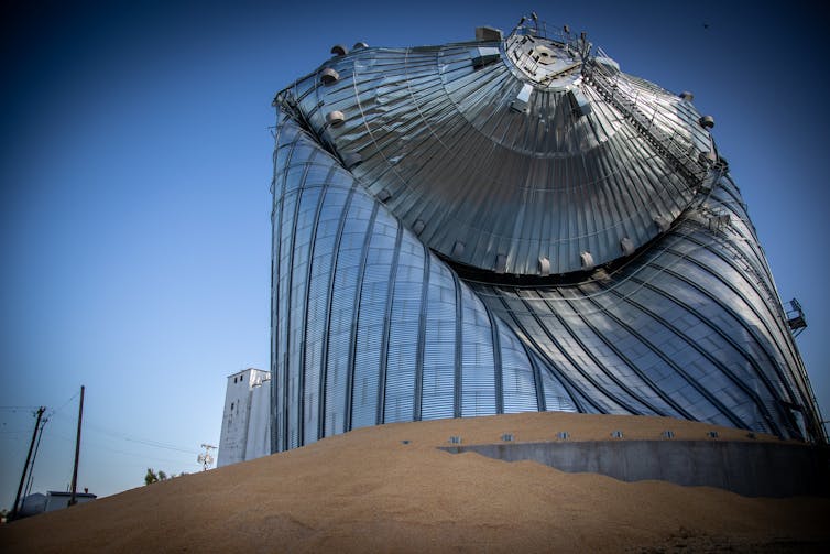 Metal silo twisted and folded by winds.