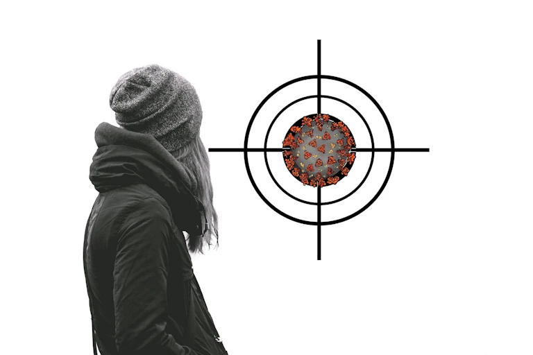 Person with their back to camera, looking at a coronavirus in a target.