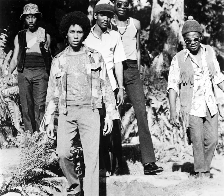 Black and white photo of the Wailers with Bob Marley in the front
