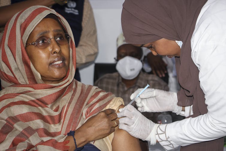 Somalian woman receives vaccine dose