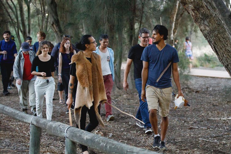 people walking outside together and smiling