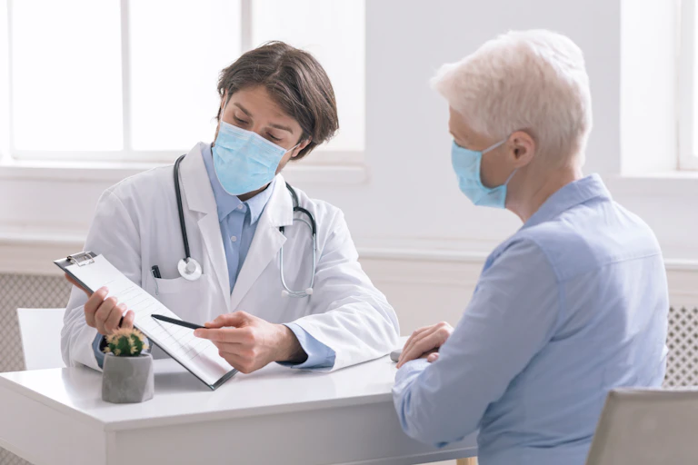 A doctor talking to his patient