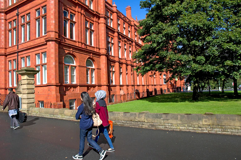 Students walking on the University of Salford's Peel Park Campus