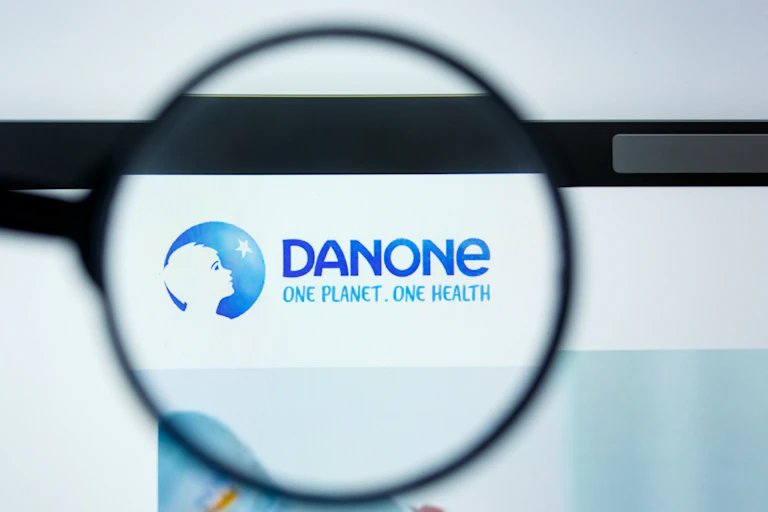 Danone logo under a magnifying glass