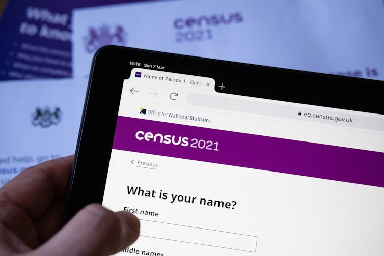 Person filling out 2021 online sensus form on a tablet