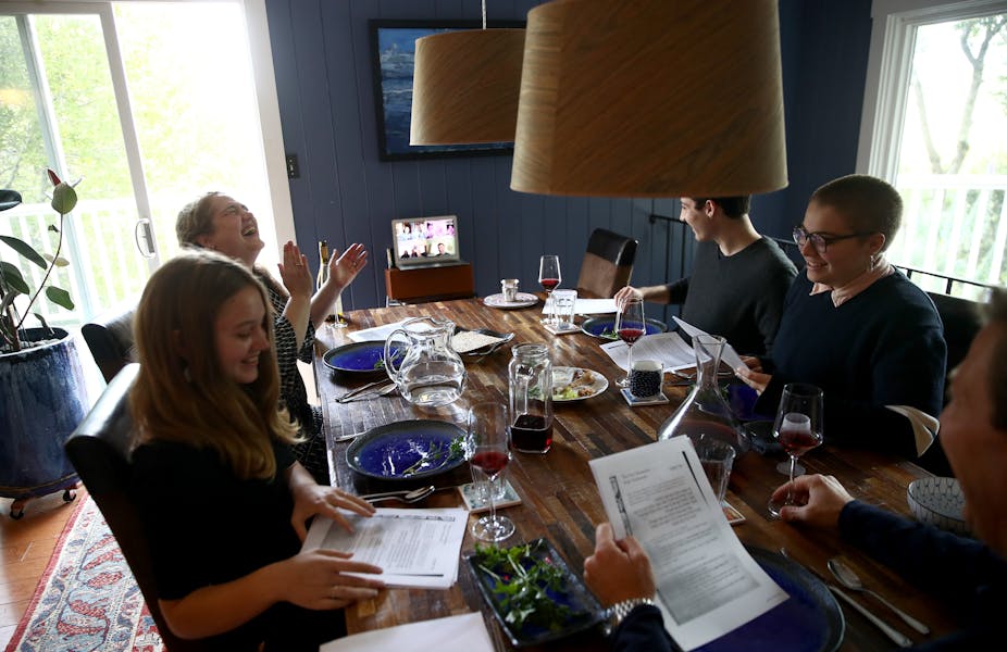 A Jewish family celebrates Passover through videoconferencing.