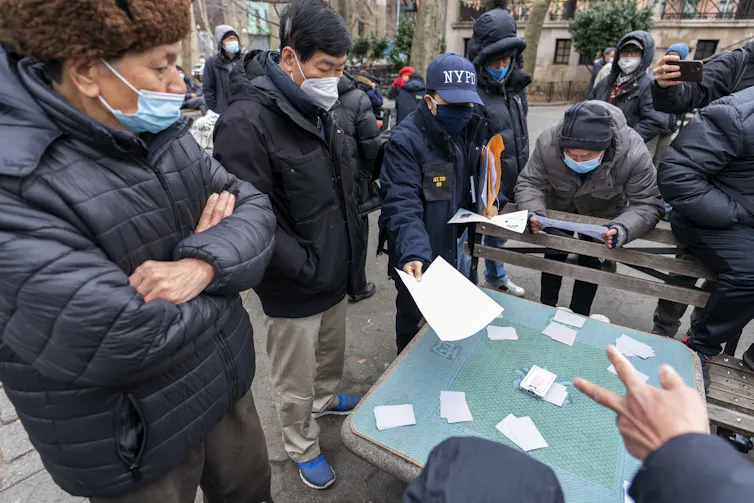Police seen handing out flyers to community members