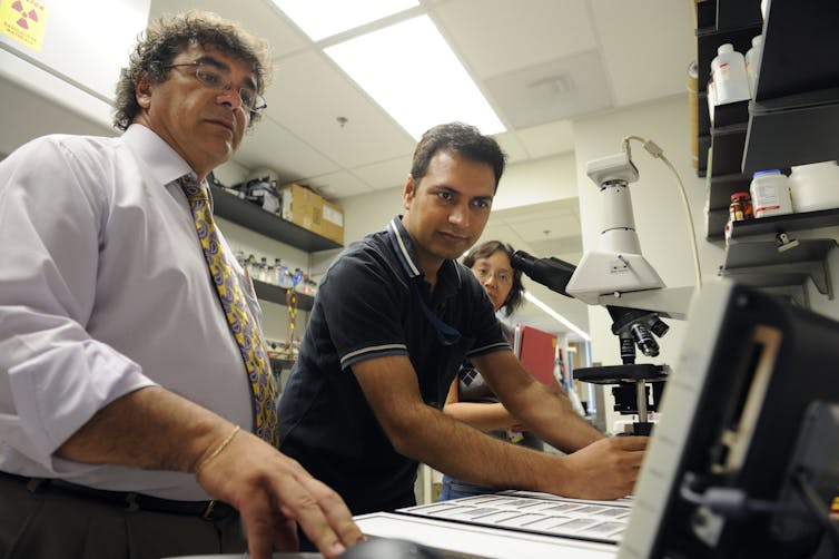 Three researchers at a university lab.