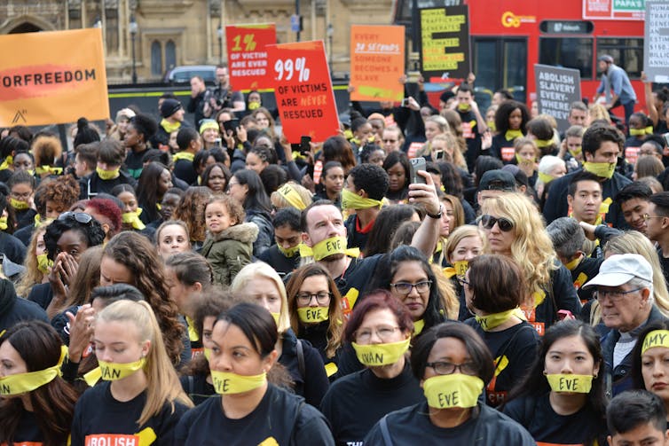 Protestors wearing yellow masks
