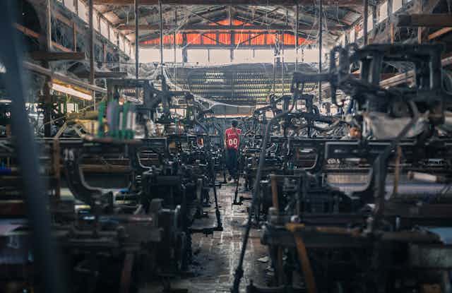 Grim looking clothing factory with machines
