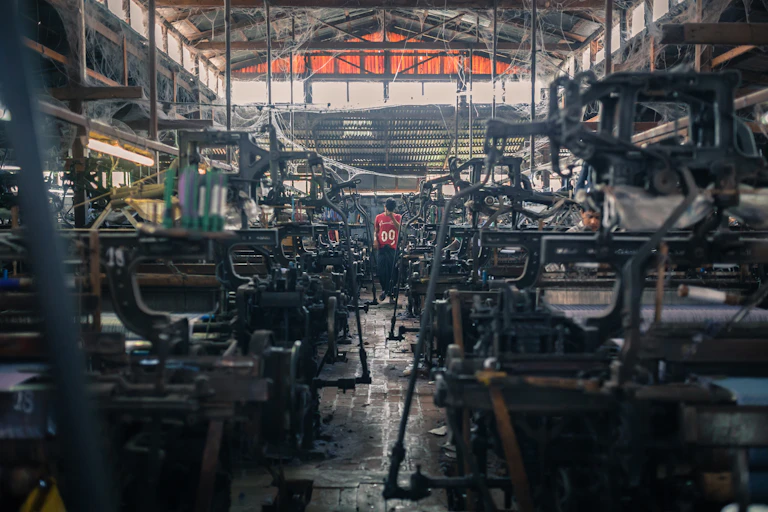 Grim looking clothing factory with machines
