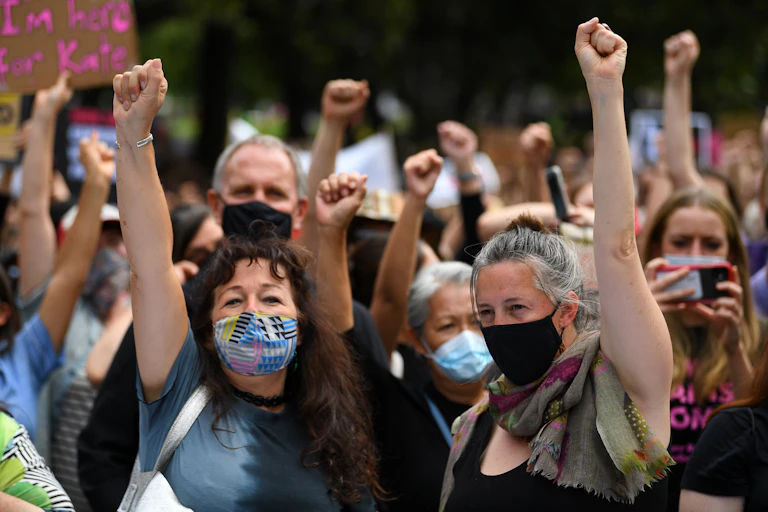 Woman marching, with March4Justice