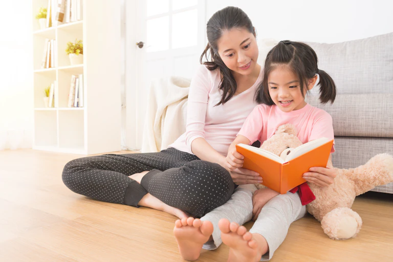 Mother reading to child.