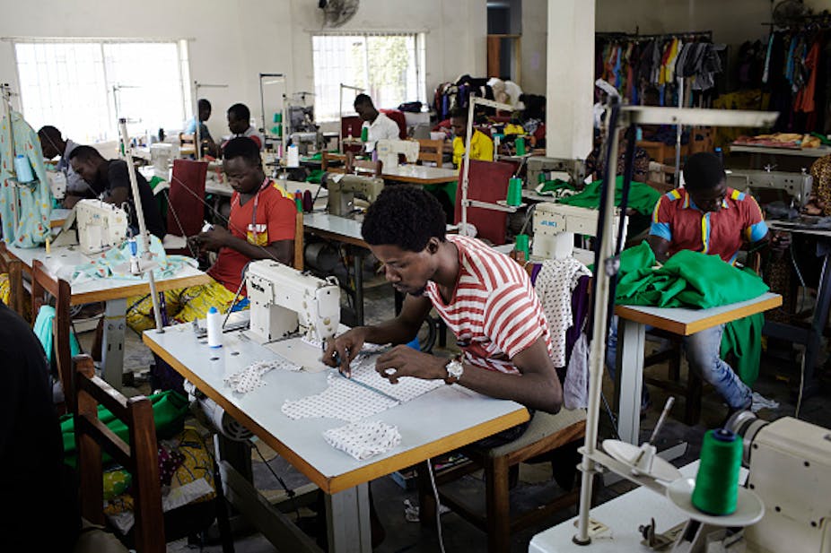 Workers sewing using sewing machines