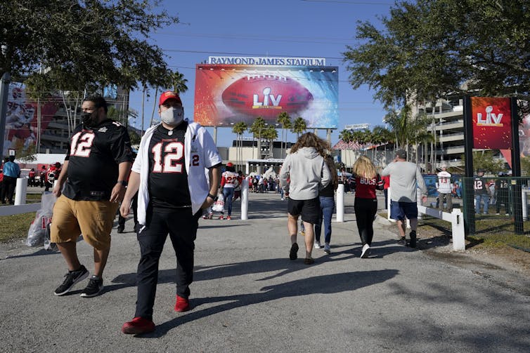 Fans arrive at Tampa's Raymond James Stadium for the Super Bowl on Feb. 7, 2021