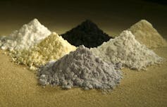 Piles of rare earth elements, clockwise from top center: praseodymium, cerium, lanthanum, neodymium, samarium and gadolinium