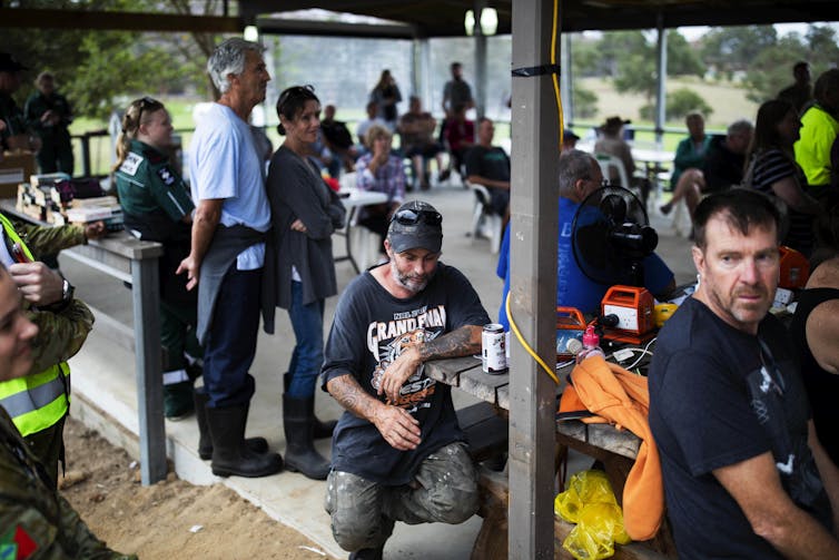 Locals gather for briefing after fires