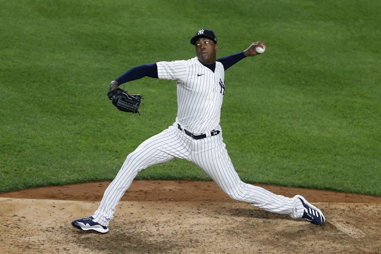 A pitcher for the New York Yankees throws a pitch.