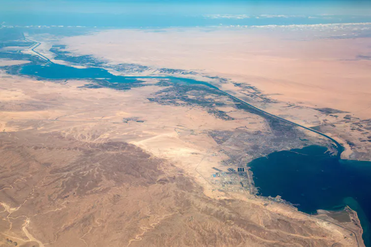 An aerial view of the Suez Canal with desert on either side.