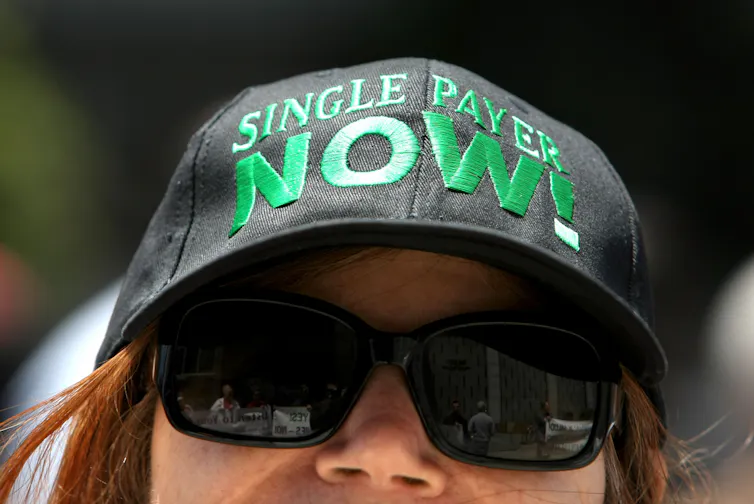 A woman wearing a hat that says