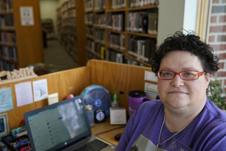 A librarian in an empty library