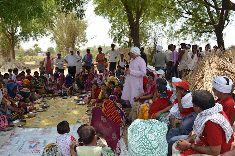 People gathered in a village in India