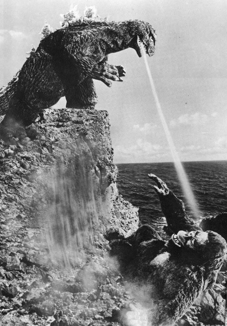 Godzilla shooting King Kong with his atomic breath from the 1962 film 'King Kong vs. Godzilla'