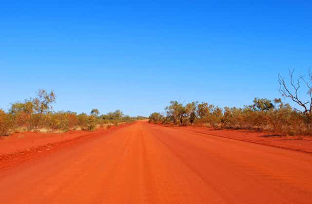 Ouback, red dusty road in Northern Territory