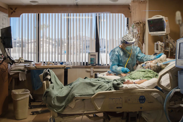 A doctor with a patient at a small hospital