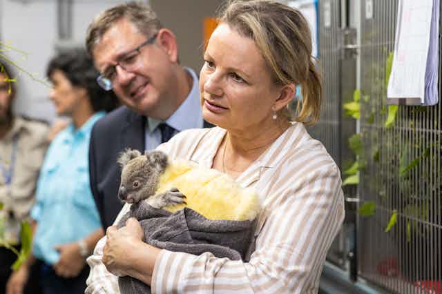 Sussan Ley holding a baby koala