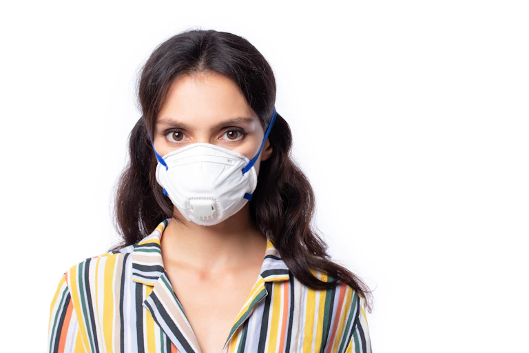 A woman wearing an N95 face mask