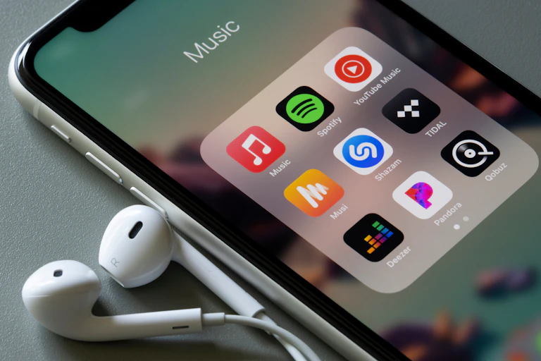 An iPhone showing a number of music apps