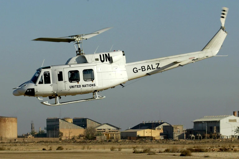 A UN helicopter with weapons inspectors on board takes of from an oil facility near the city of al-Hadithah, 300km northwest of Baghdad, 11 January 2003.