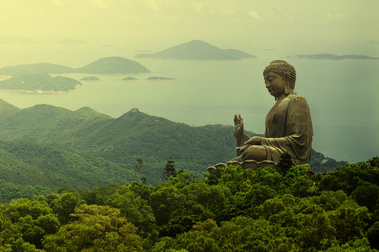 Hong Kong, Lantau Island Giant Buddha of Po Lin Monastery far away view during sunrise