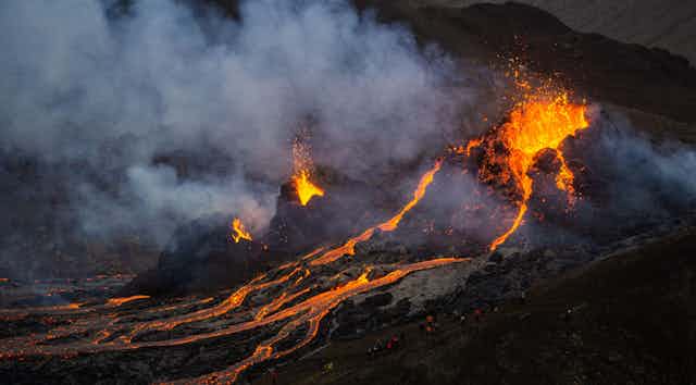 Molten lava flowing from a small volcanic eruption in Mt Fagradalsfjall, near the capital of Reykjavik, Southwest Iceland.
