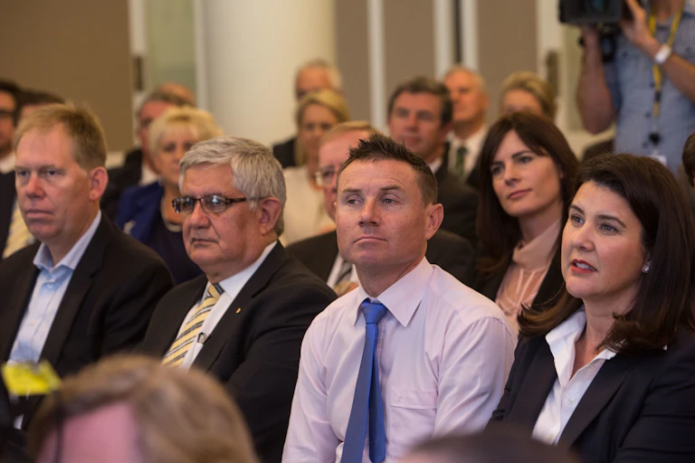 Government MP Andrew Laming with colleagues in a party room meeting.