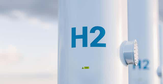 A storage tank with "H2" sign