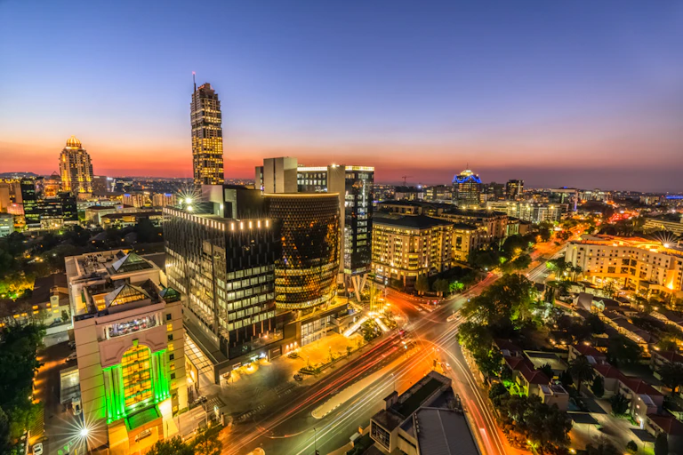 Aerial shot of a brightly lit city at night.