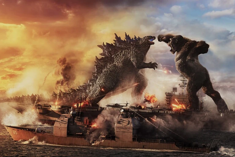 Godzilla and Kong fighting on a large ship.