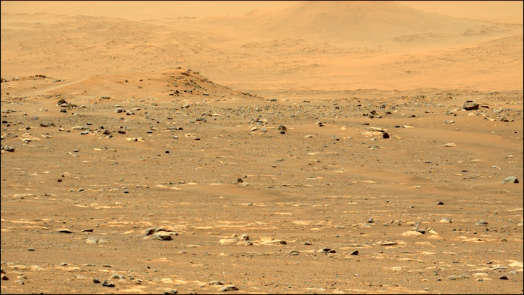 Yellowish orange sandy surface of Mars.