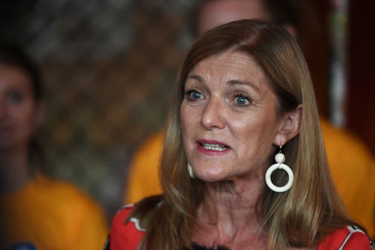 woman speaking at a press conference