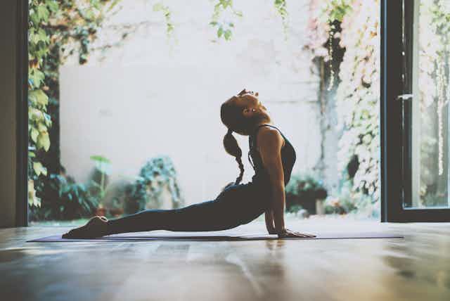 A woman in a yoga pose.