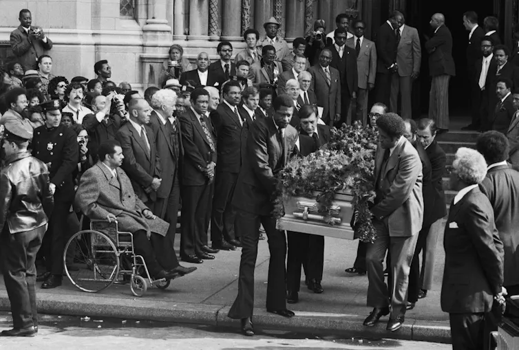 Jackie Robinson's casket being carried from a church.