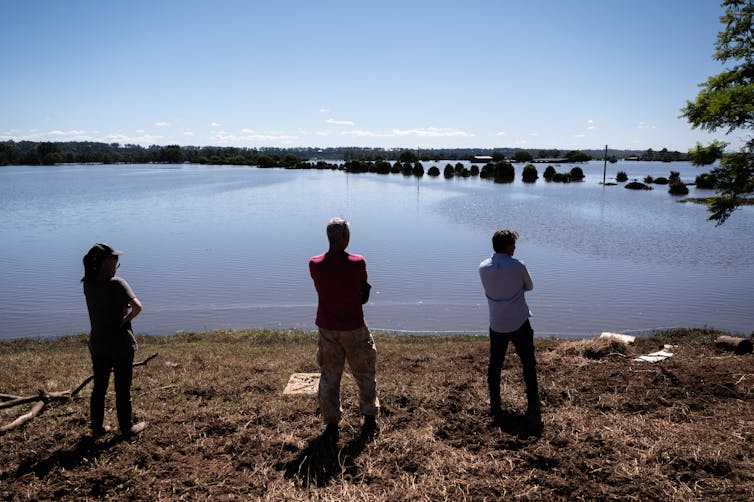 People look at flooded floodplains in NSW.
