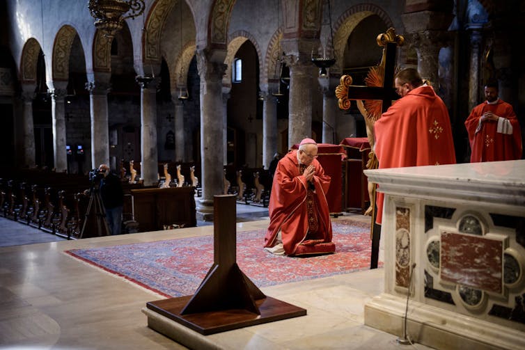 The ceremony of the veneration of the cross, Cathedral of San Giusto, Italy.