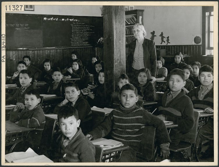 Students sit in classroom at Indian Residential School