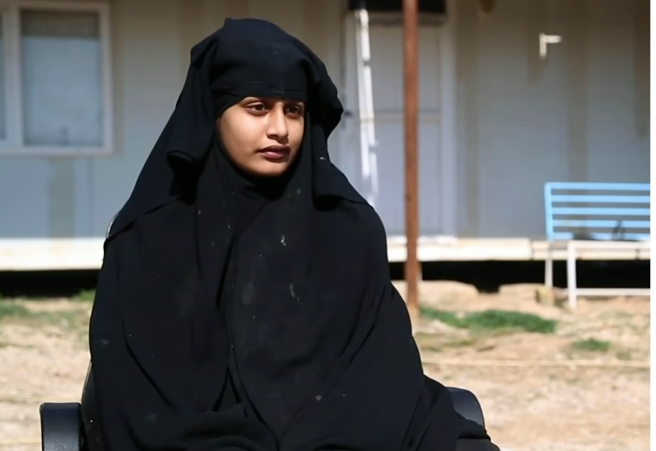 Shamima Begum wearing black and sitting in the sun