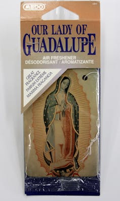 A Lady of Guadalupe car air freshener on display at the Marian Library