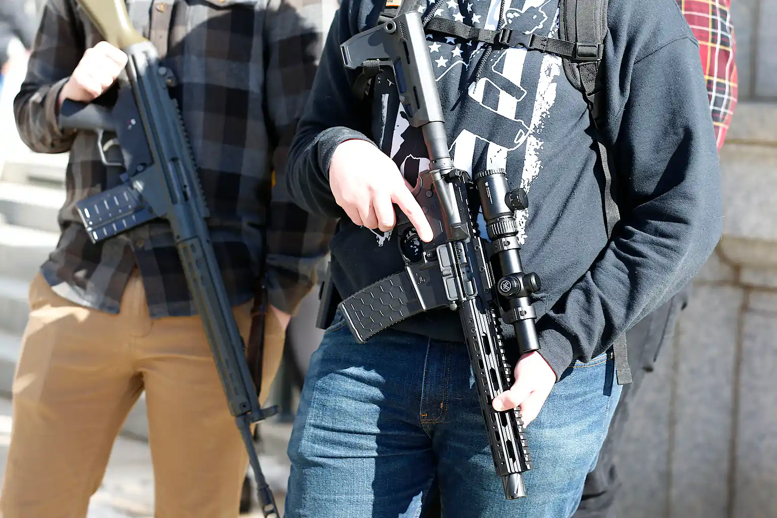 Man Carrying Assault Rifles In gun debate, both sides have evidence to back them up