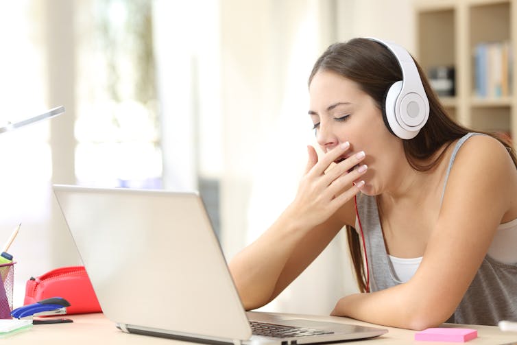student yawns during an online learning session